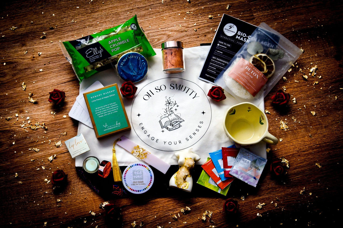 Ultimate luxury self-care hamper with floral teacup, crystal candle, and mystery romance book